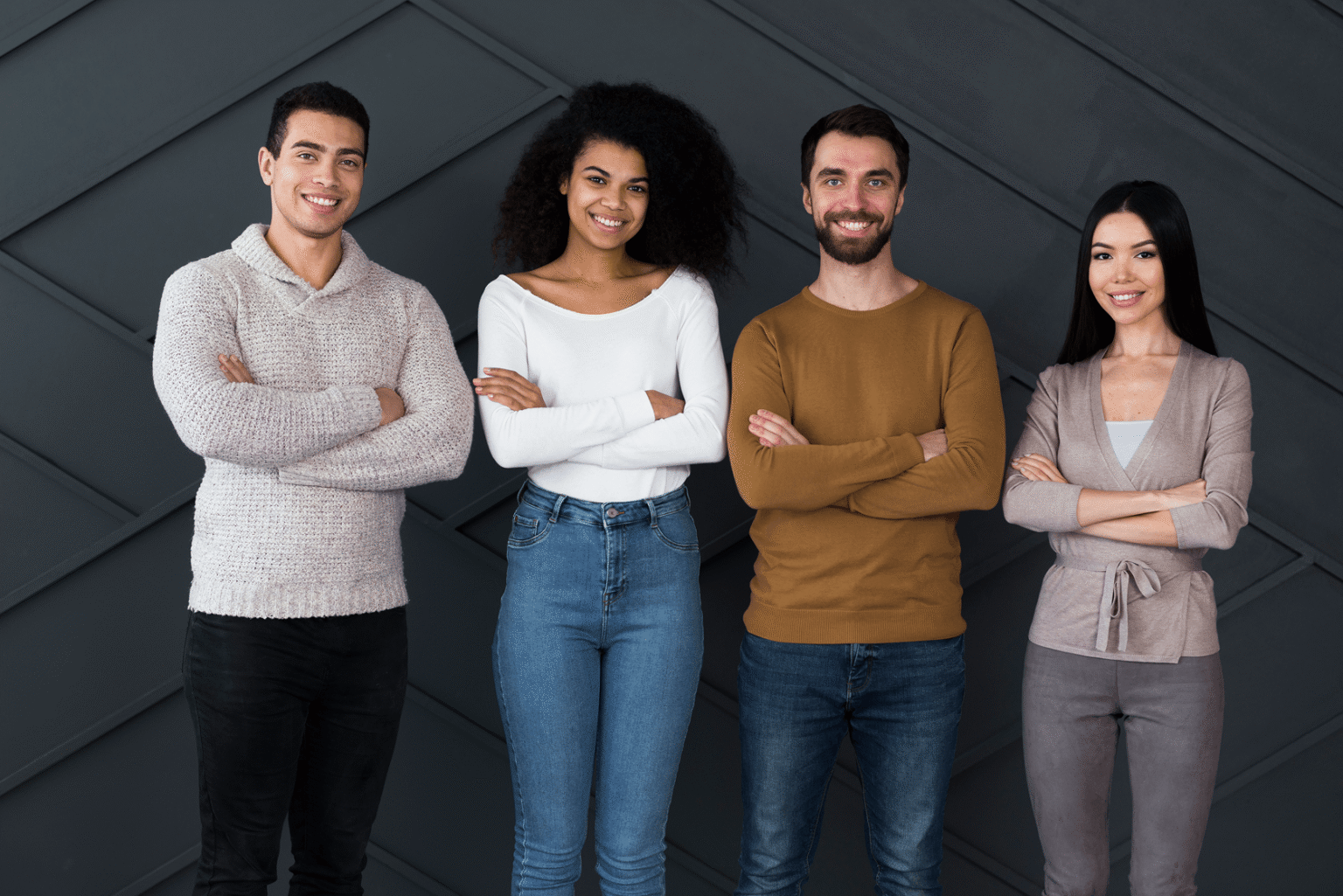 Group of people smiling with arms crossed